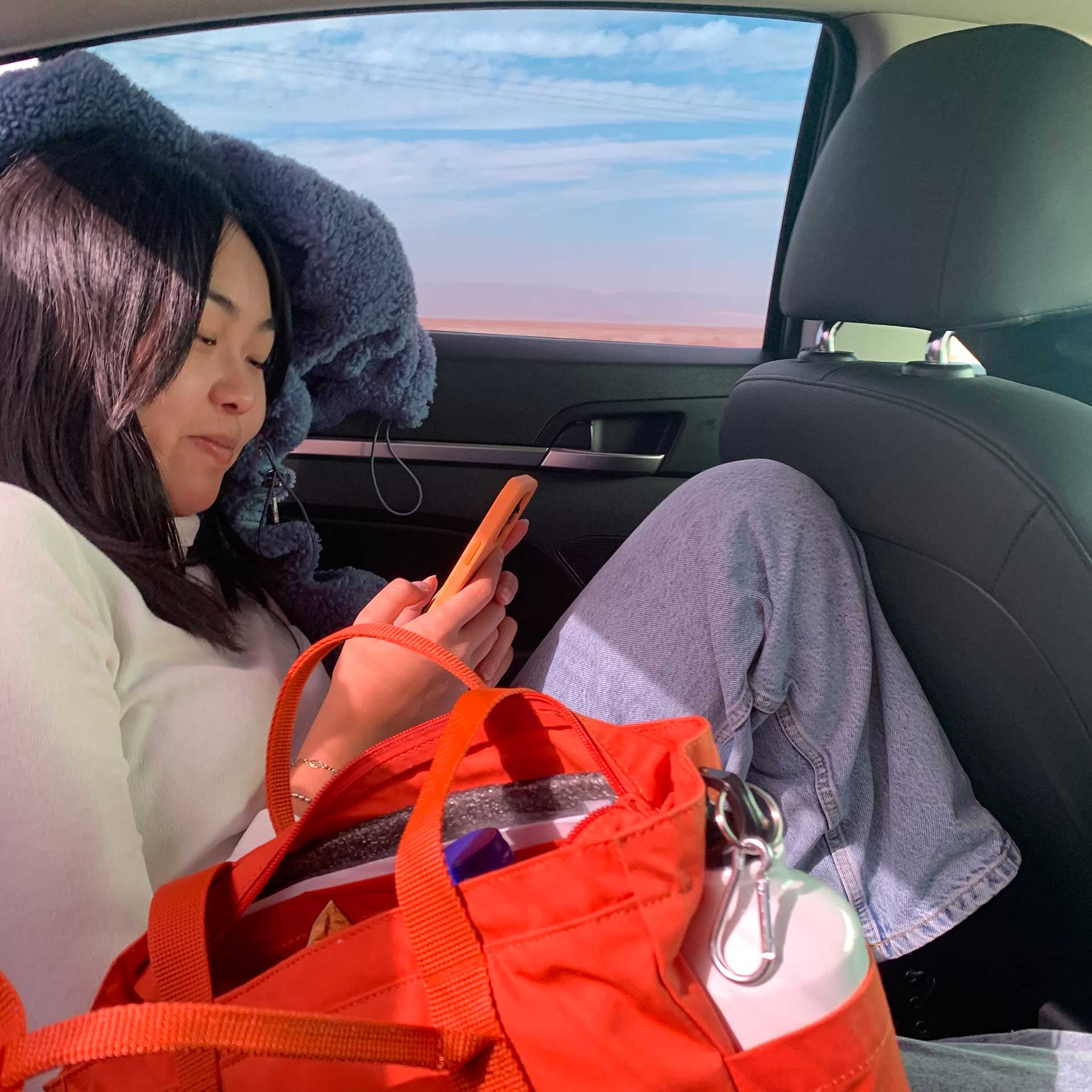 Aurora Zhu chatting on the phone while riding a cab